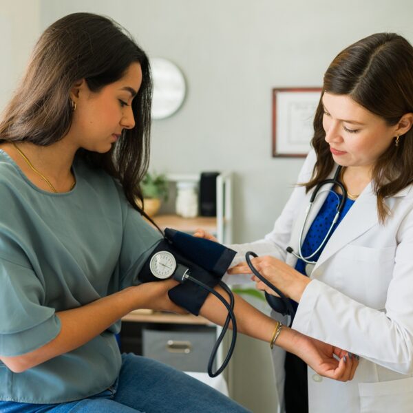 Young,Female,Patient,Having,Her,Blood,Pressure,Checked,By,A
